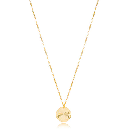 Gold necklace with a round pendant 